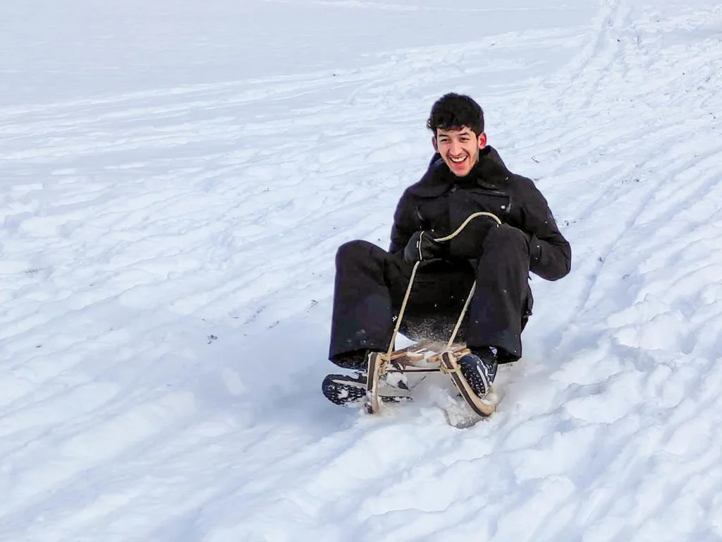 wetransform software engineer Morchid Chellali on a sleigh