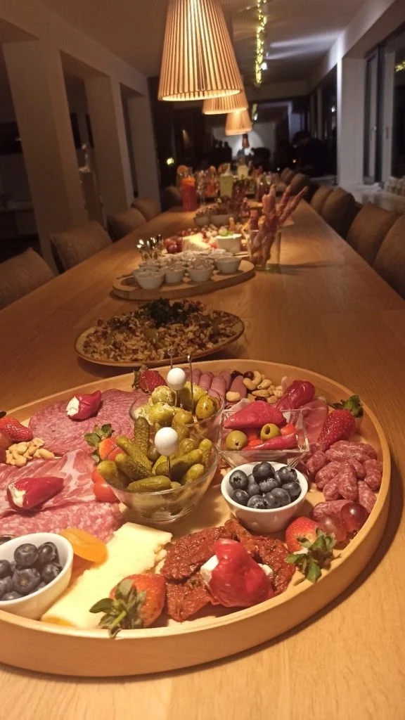 Food stretches out across two long tables during the wetransform 2024 offsite.