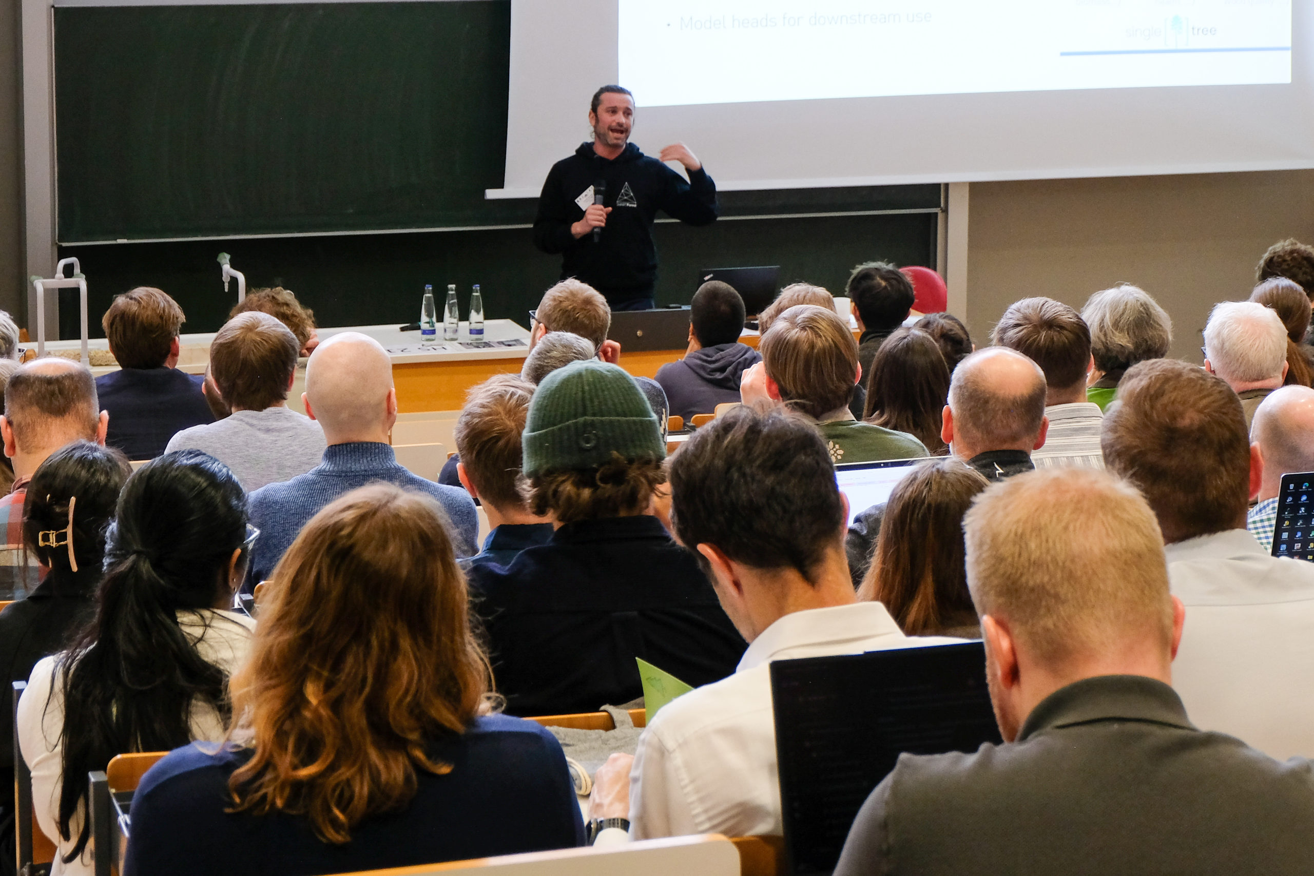 Audience attentively listening to Stefano Puliti of NIBIO delivering a SmartForest 2026 keynote presentation